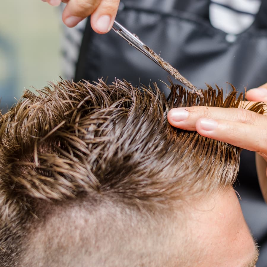 men's hair cutting scissors in a beauty salon